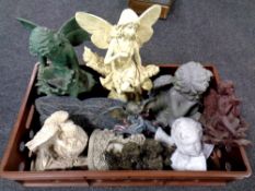 A large crate containing a large quantity of composite figures, cherubs,