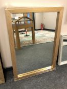 A contemporary gold effect bevelled mirror,