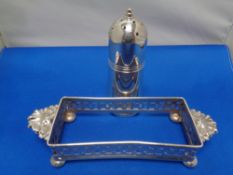 A silver plated table salt and bottle holder