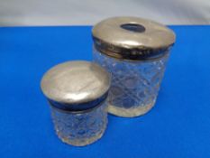 Two cut glass silver topped dressing table jars