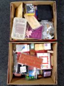 Two boxes containing a large quantity of crafting materials to include stamps, die cutters,