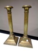 A pair of 19th century brass Corinthian column candlesticks