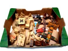 A box containing wooden tourist figures,