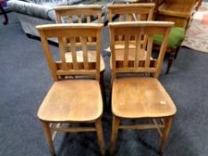 A set of four 20th century chapel chairs