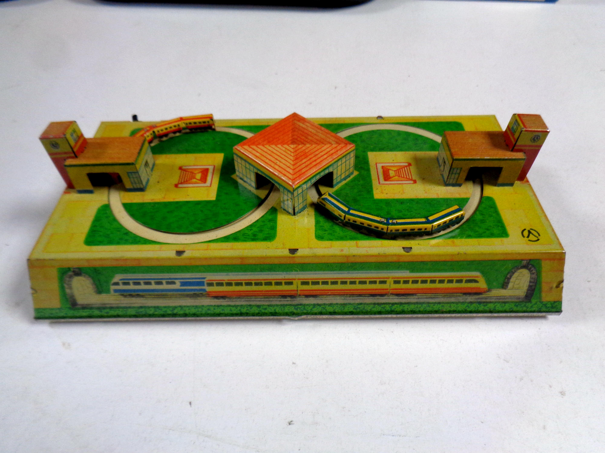 A tin plate miniature wind up railway with key