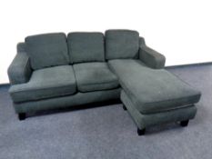 A contemporary corner settee upholstered in a charcoal fabric