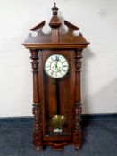 An Edwardian Vienna wall clock with brass and enamelled dial,