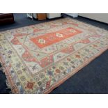 A Melas carpet, Western Anatolia, with peach central field of stylised medallions,