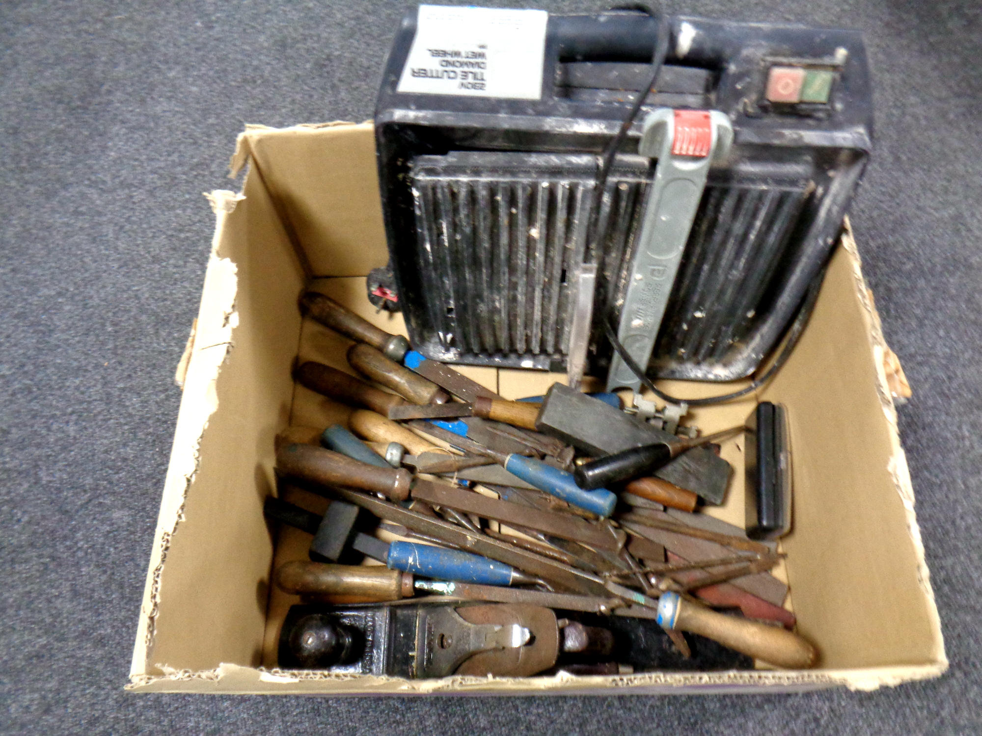 A box containing a Performance tile cutter,