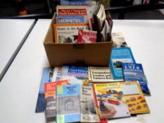 A box containing vintage books relating to trains, railways,