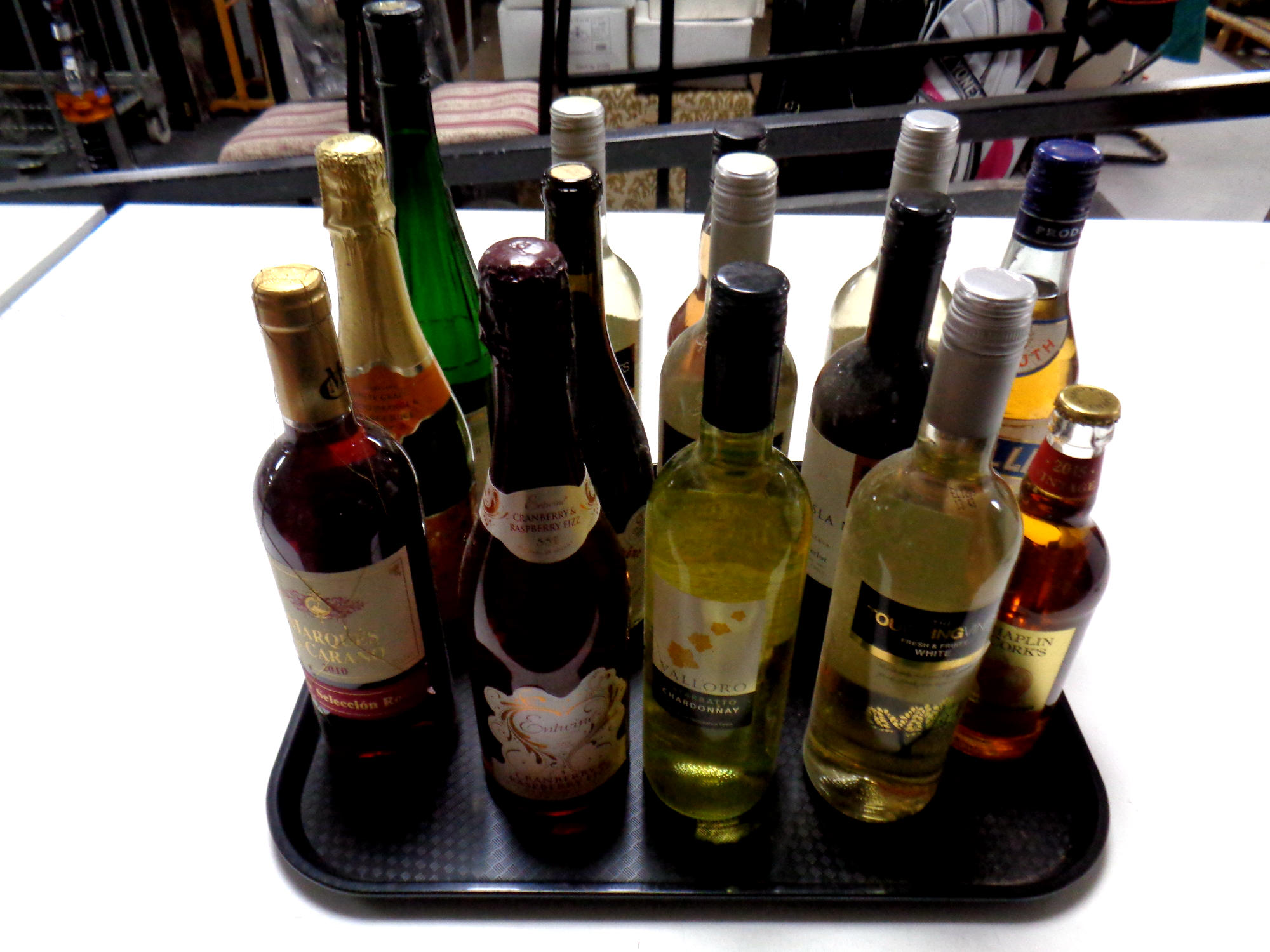 A tray containing thirteen assorted bottles of wine,