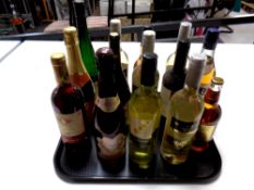 A tray containing thirteen assorted bottles of wine,