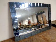 An all glass contemporary framed mirror,