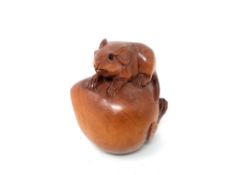 A Chinese carved hardwood netsuke - rat on pumpkin