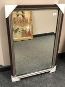 A contemporary bevelled mirror in a two tone frame,