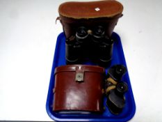 Two pairs of leather cased binoculars