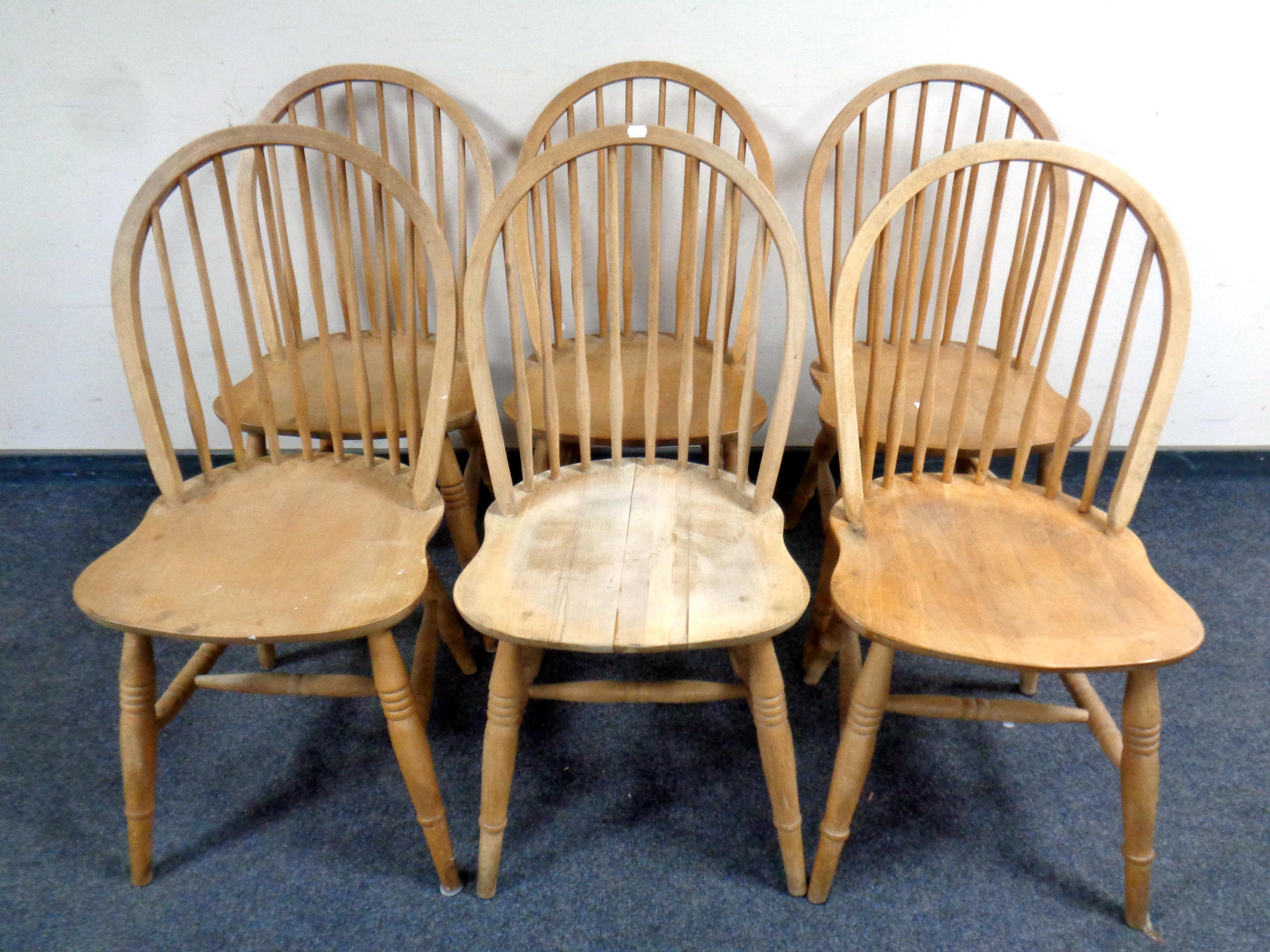 A set of six pine stickback kitchen chairs