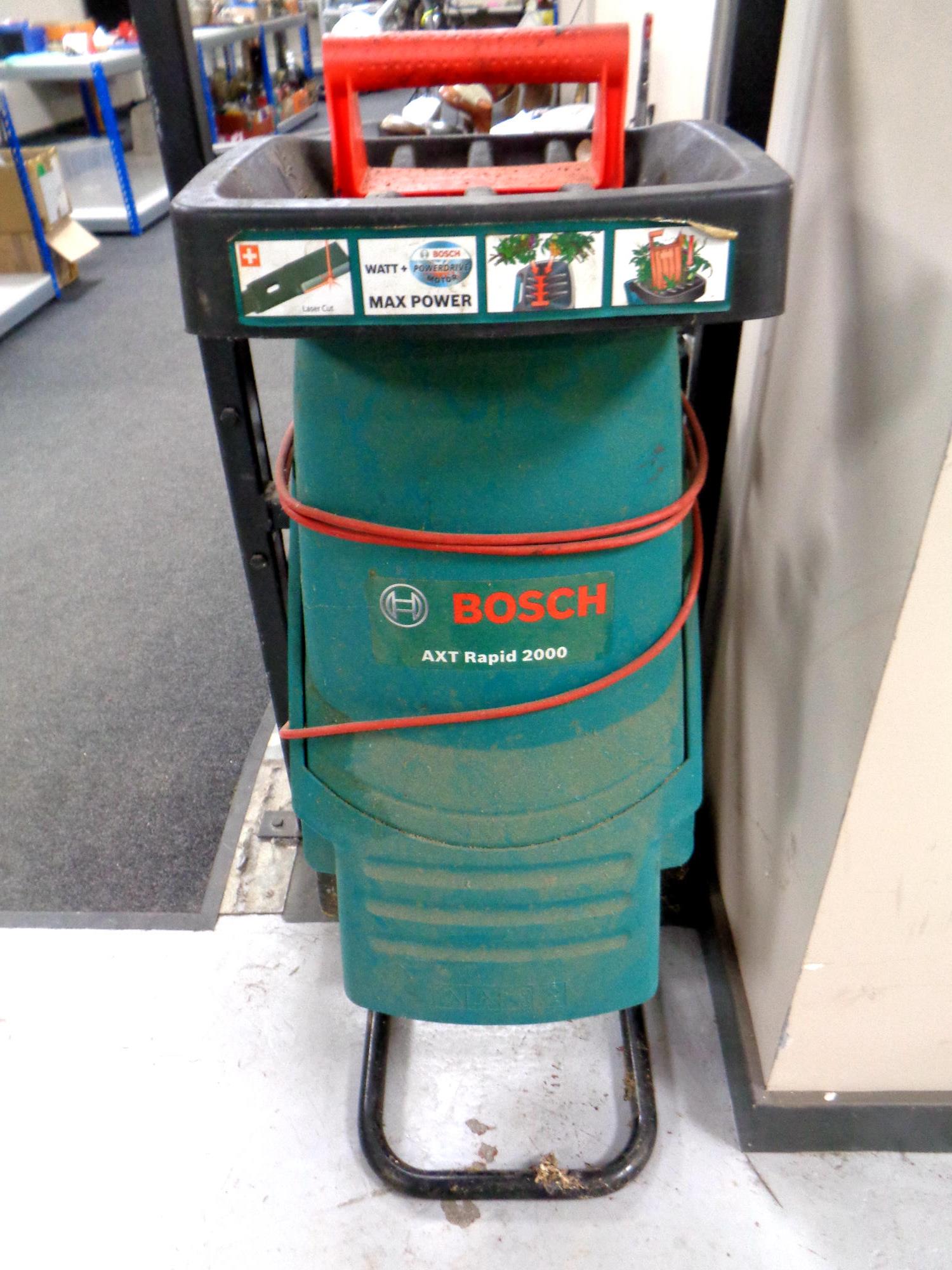 A Bosch AXT Rapid 2000 garden chipper shredder