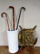 Two pottery jugs and a ceramics stick stand containing sticks (one with silver mount),