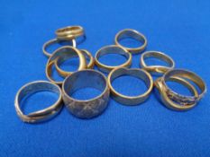 Twelve brass sample wedding bands