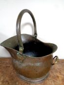 A 19th century copper and brass swing handled coal bucket