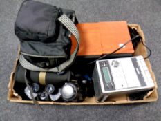 A box containing Samsung camcorder in bag, pair of Tasco binoculars,