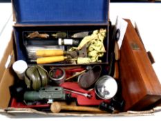 A box containing gun equipment to include tools, ear muffs, air rifle pellets, scope,