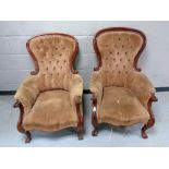 A pair of Victorian mahogany framed armchairs upholstered in a brown button dralon