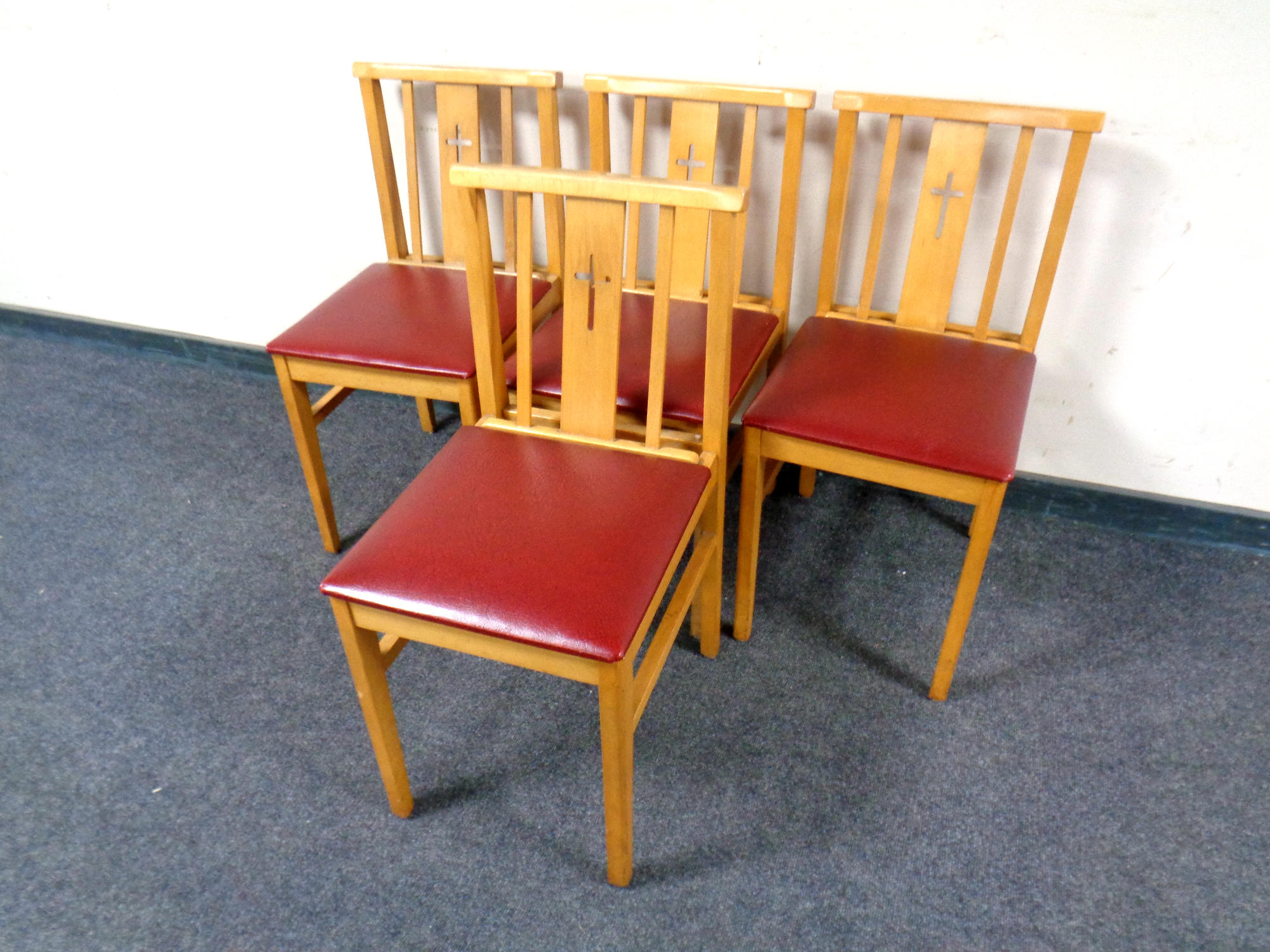 A set of four church chairs