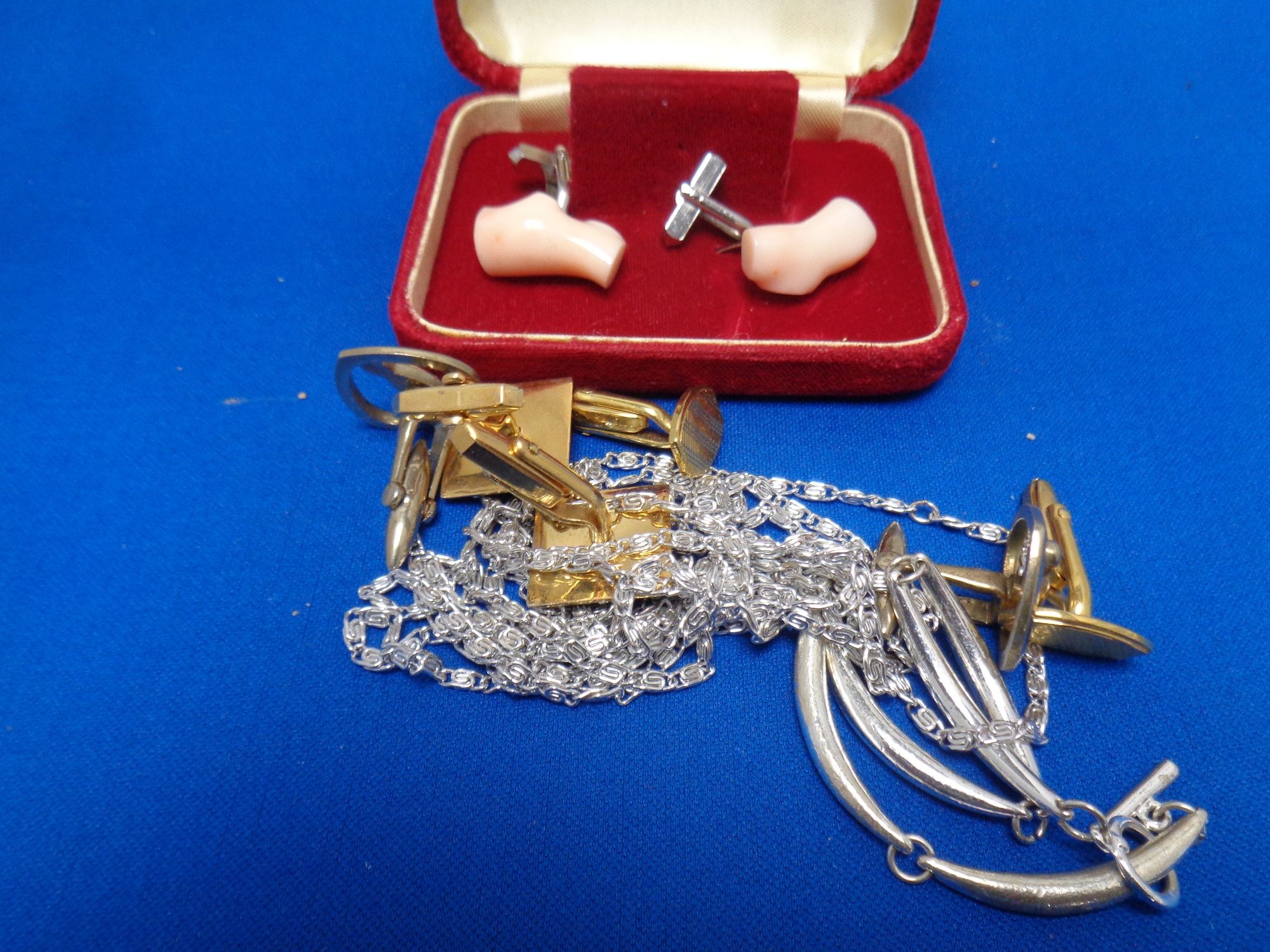 A small quantity of costume jewellery including cuff links, bracelet,