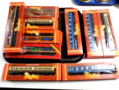 A tray containing Hornby Railways 00 scale coaches and car transporters,