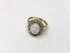 A 9ct gold opal cluster ring, size O. CONDITION REPORT: 4.