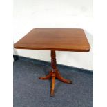 A 19th century tilt top mahogany pedestal occasional table