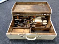 A vintage joiner's tool box containing hand tools, egg whisk drill, plane, brace,