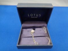 A Lotus Jewellery pendant on chain