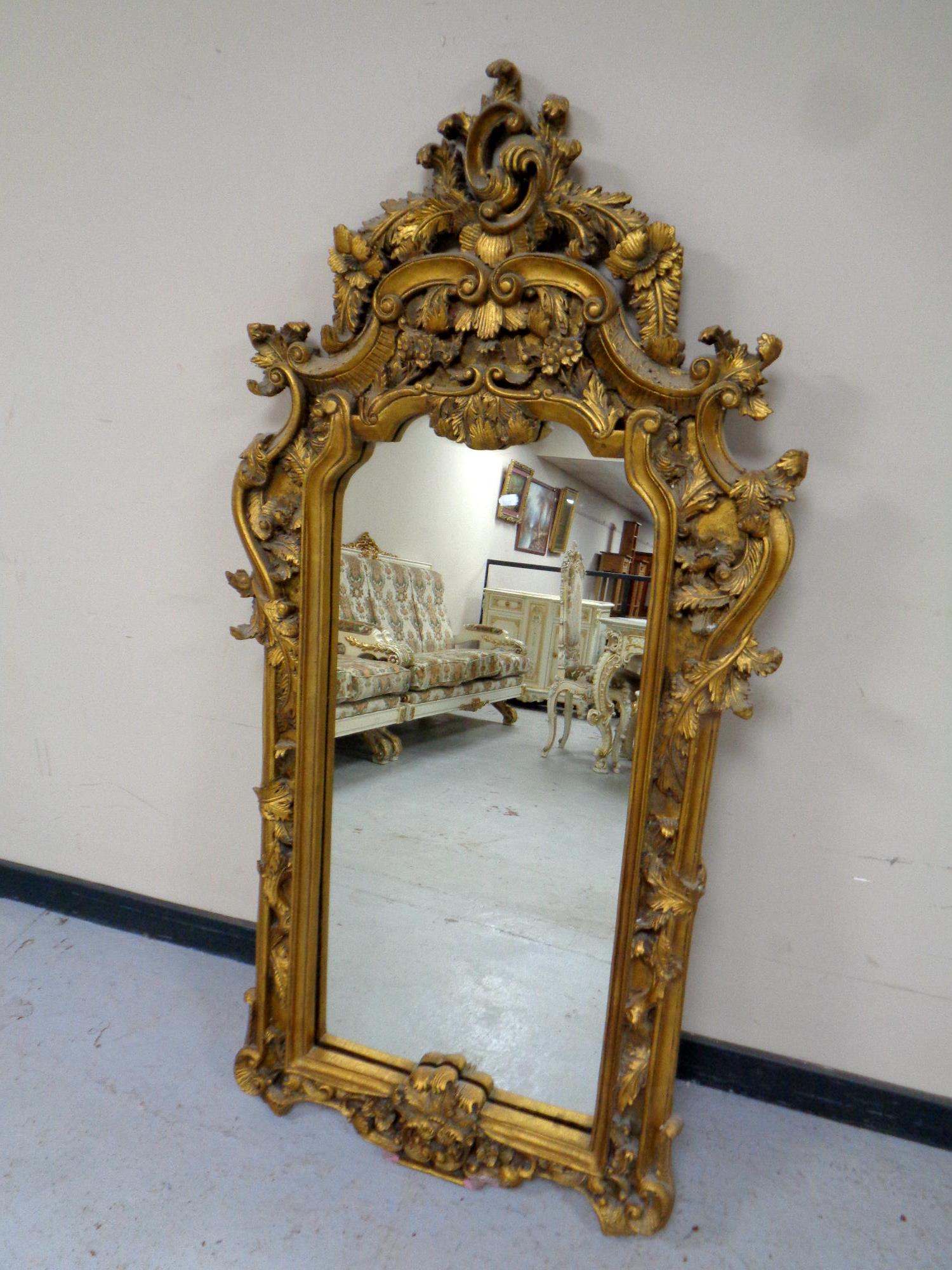 A Rococo style gilt mirror,