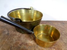 An antique brass cast iron handled jam pan together with a further brass cast iron handled pan