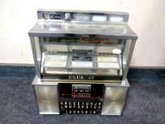 A 20th century American wall mounted juke box