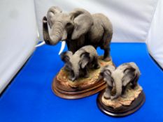 Two Royal Doulton elephant sculptures on wooden plinths