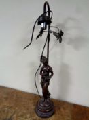 A figural table lamp