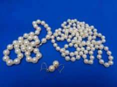 Two costume pearl necklaces and an earring