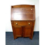 A 20th century oak lady's bureau