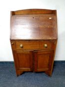 A 20th century oak lady's bureau