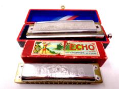 A boxed Hohner Super Chromonica together with a further Echo harmonica,