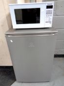 An Indesit under bench freezer and a Panasonic microwave