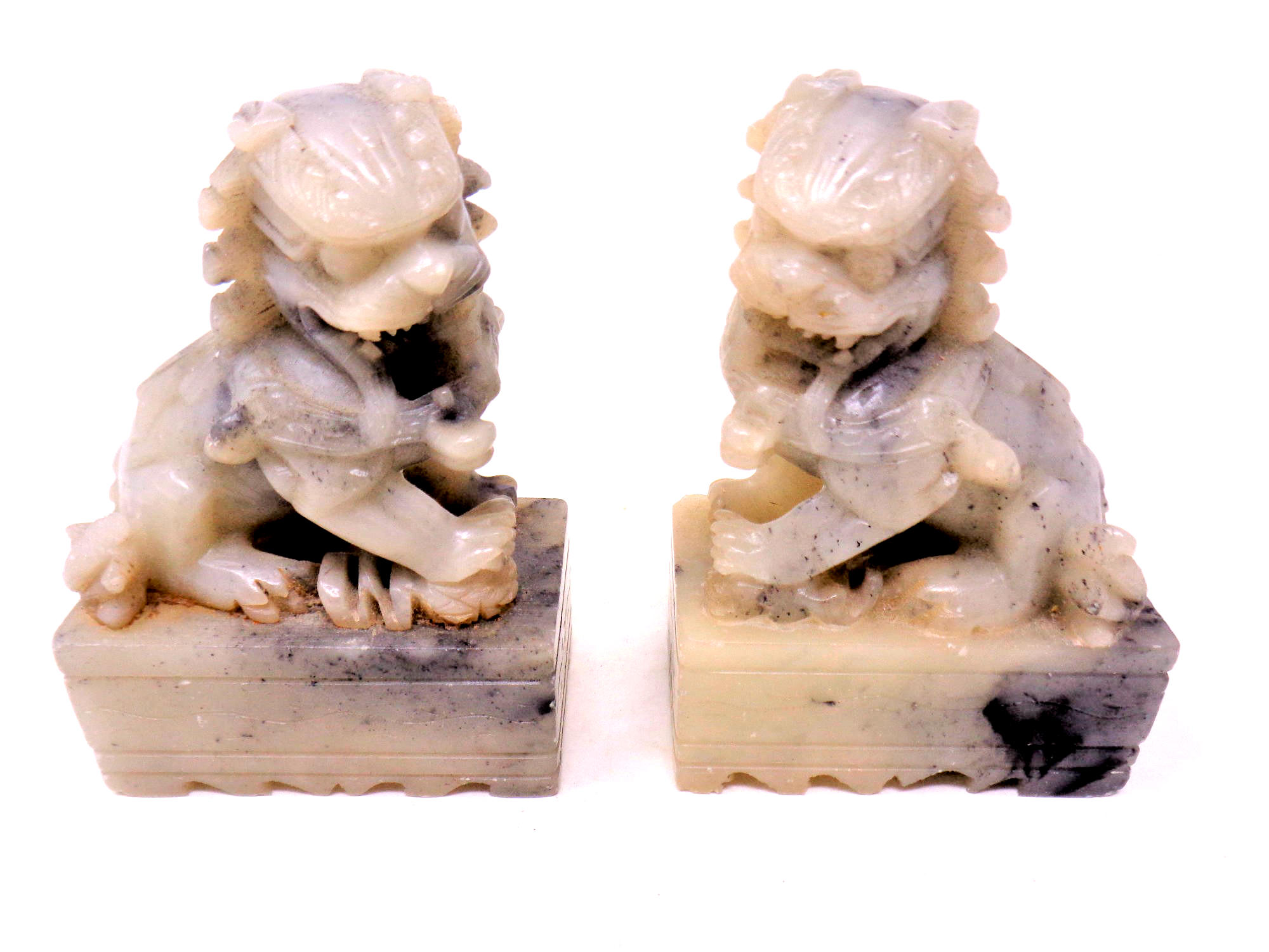 A pair of Chinese soapstone foo dogs, height 9.