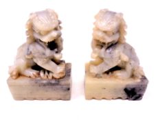 A pair of Chinese soapstone foo dogs, height 9.