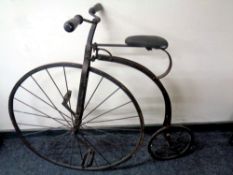 A 19th century penny farthing bike with later saddle,