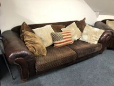 A Tetrad leather and fabric settee with scatter cushions