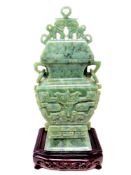 A Chinese carved jade koro on a wooden stand, height 29.